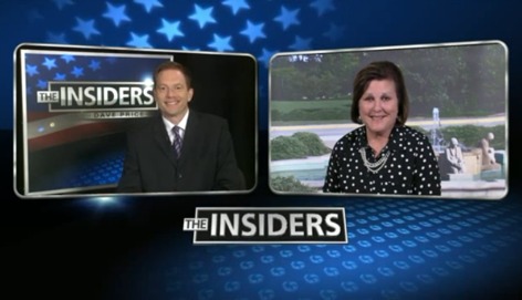 Newscaster Dave Price interviews ISU's Dianne Bystrom via live v