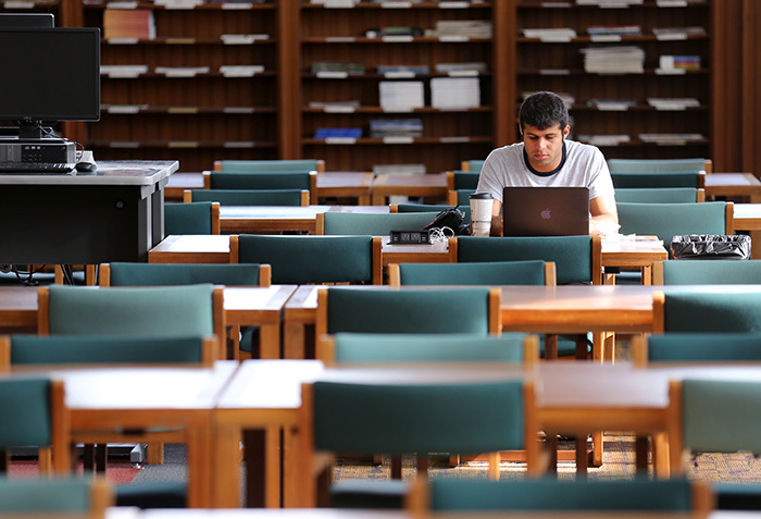 Male student studies alone in Parks reading room