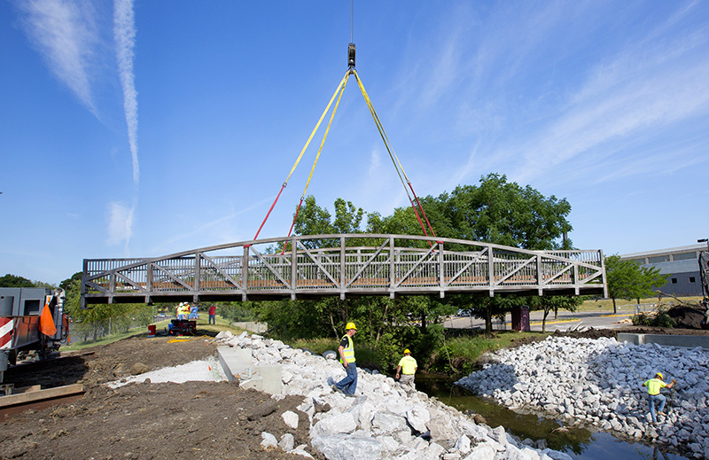 Installation of pedestrian bridge over College Creek.