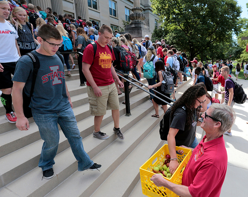 Student ascend and descend the front stairs of Curtiss Hall