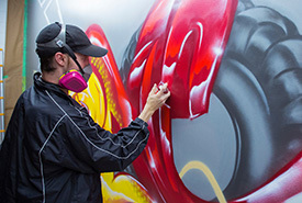 Tim Westrom paints a wall mural