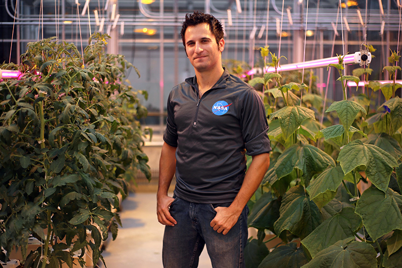 Alex Litvin in a horticulture growth chamber