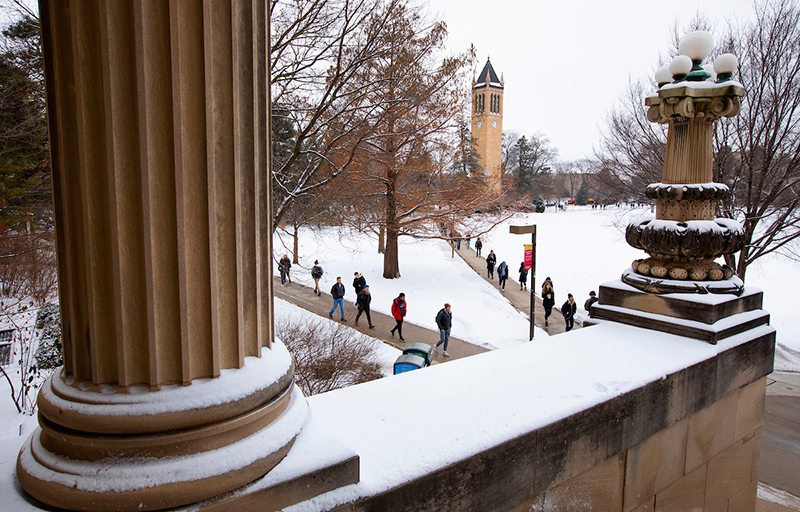 New snow covers central campus around the campanile