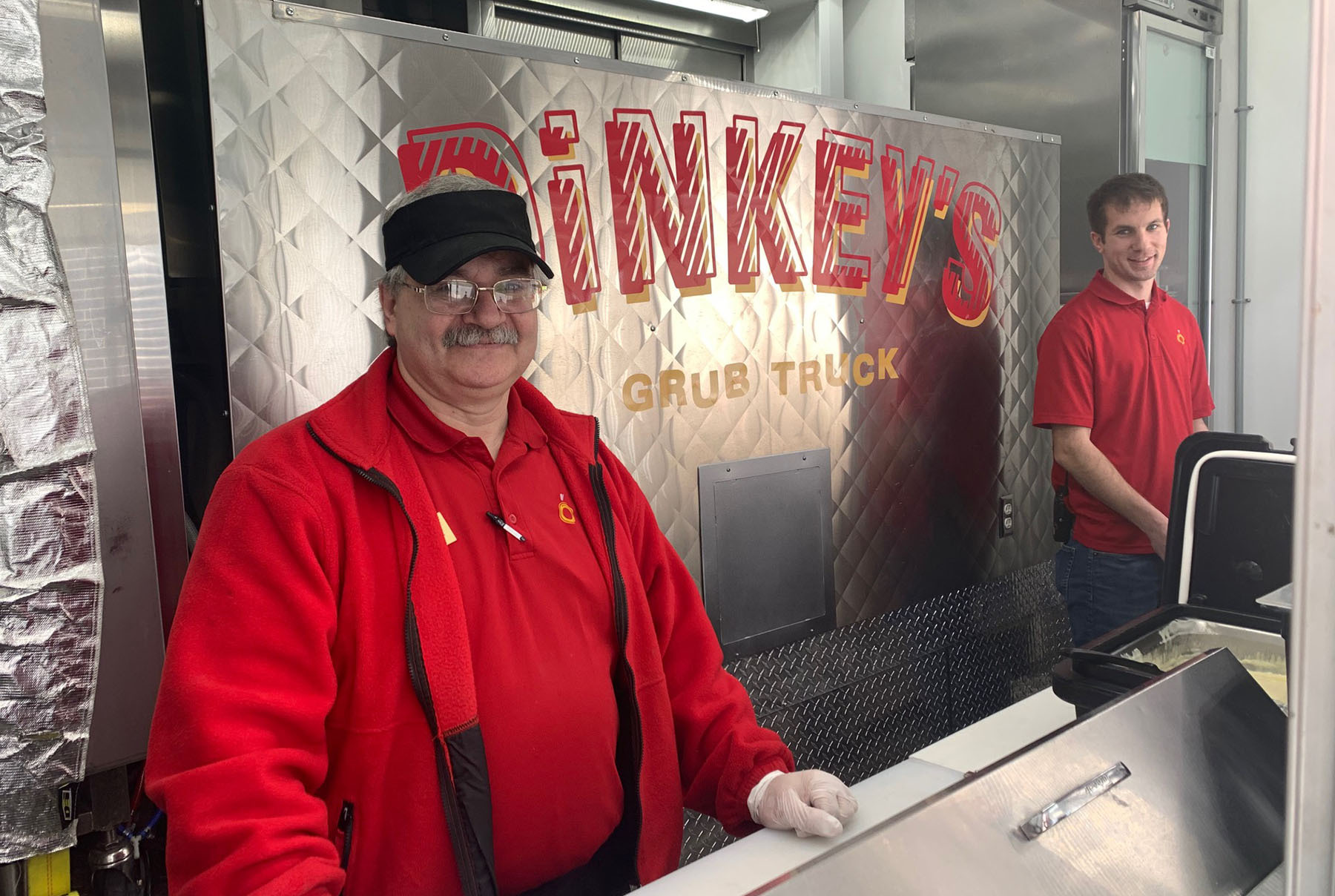 Food service managers in the Dinkey's food truck