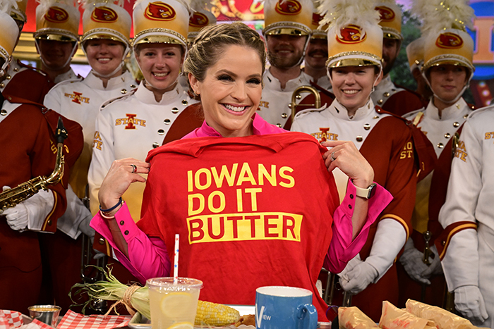 Sara Haines with a red and gold "Iowans do it Butter" shirt