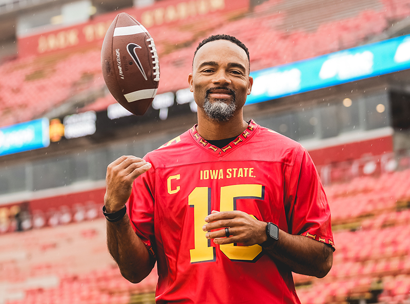 Seneca Wallace in throwback 2002 red football jersey