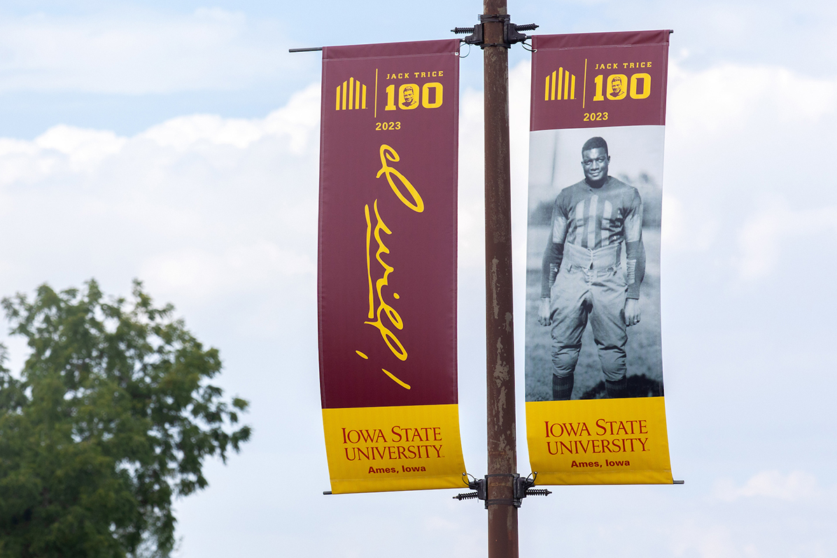Street banners with Jack Trice photo and script
