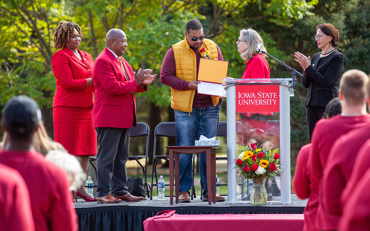 George Trice accepts the posthumous degree from Wendy Winterstee