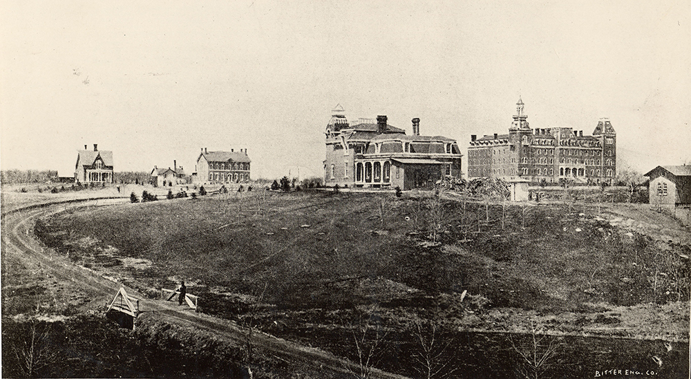 1876 image of campus with about five brick buildings