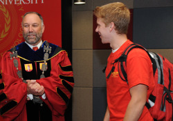 Student chats with Leath at the installation reception