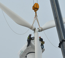 Workers work on the turbine blades