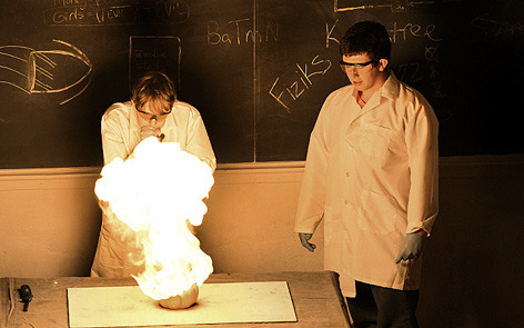 Chemistry majors peer at their smoky creation