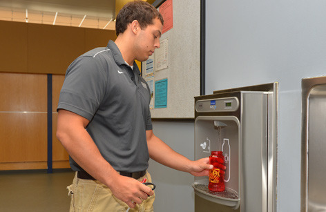 At the water dispenser