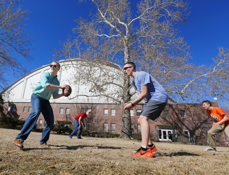 ROTC members play pick-up football