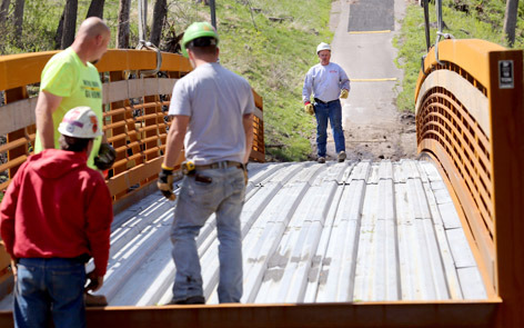 Installation crew on deck of new steel bridge