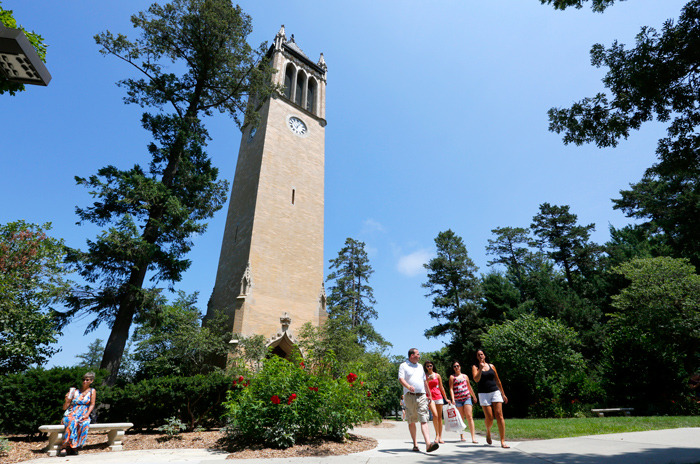 Visitors walk around the campanile