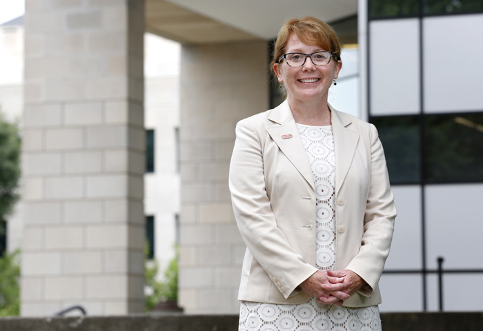 Beth McNeil stands outside Parks Library.