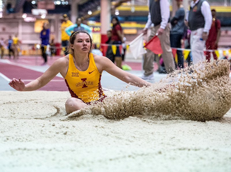 Kate Hall participating in the long jump.