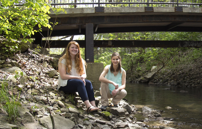 Megan Gilbert and Kelsey Faivre on the bank of College Creek