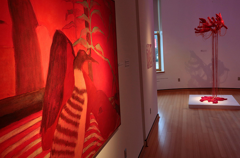 Red painting and red sculpture in exhibit hall