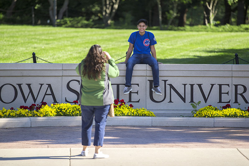 Student photo at the ISU wall.