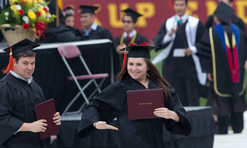 Female graduate shows off her diploma