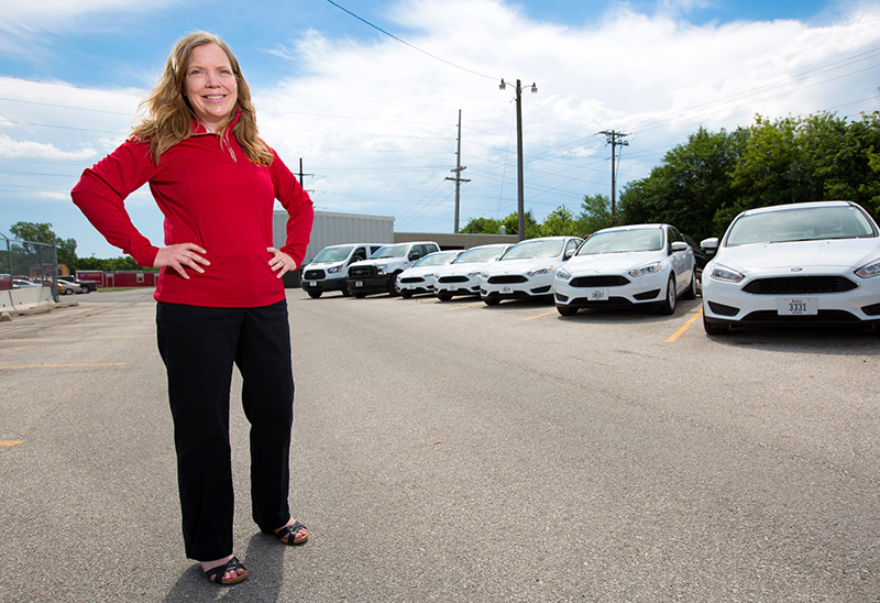 Kathy Wellik in fleet parking lot