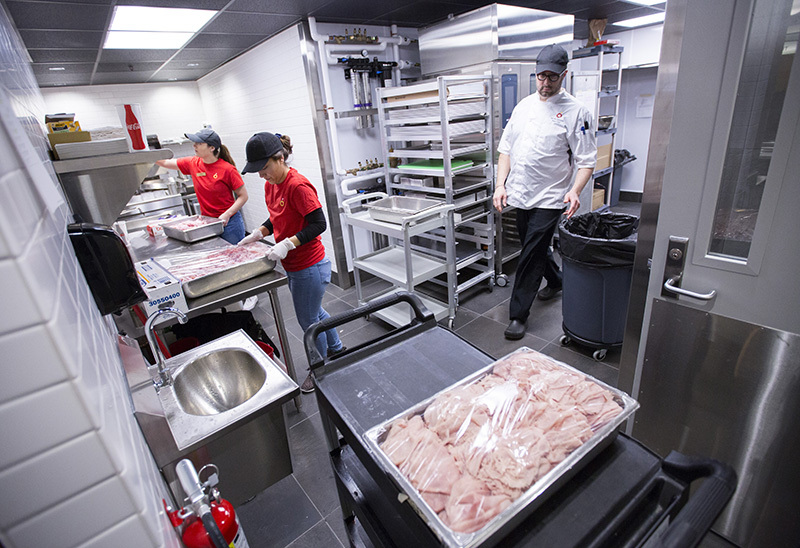 Kitchen work in Lance and Ellie's deli