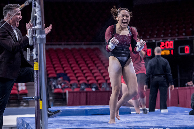 Briana Ledesma celebrates gymnastics routine.
