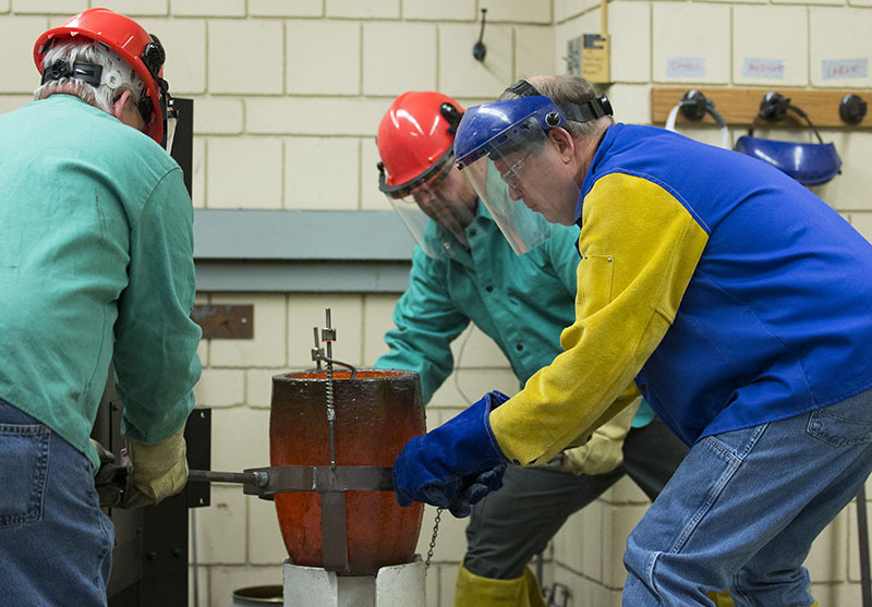 Moving the crucible filled with liquid tin/copper