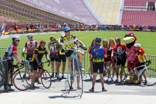 RAGBRAI riders stop for a photo at Jack Trice Field.
