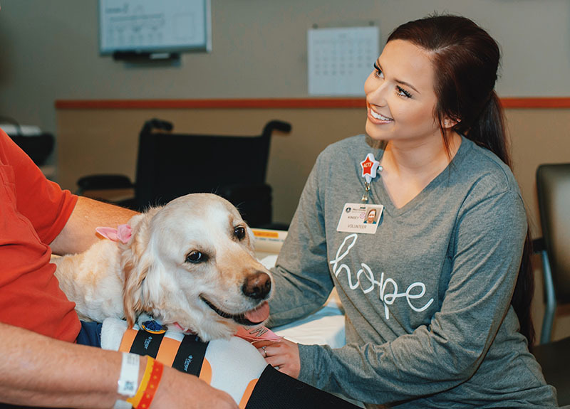 Kinsey Phillips and her certified therapy dog, Zosia.