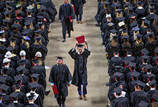 Graduate celebrates after receiving diploma