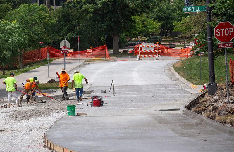 Concrete crew prepares road bed