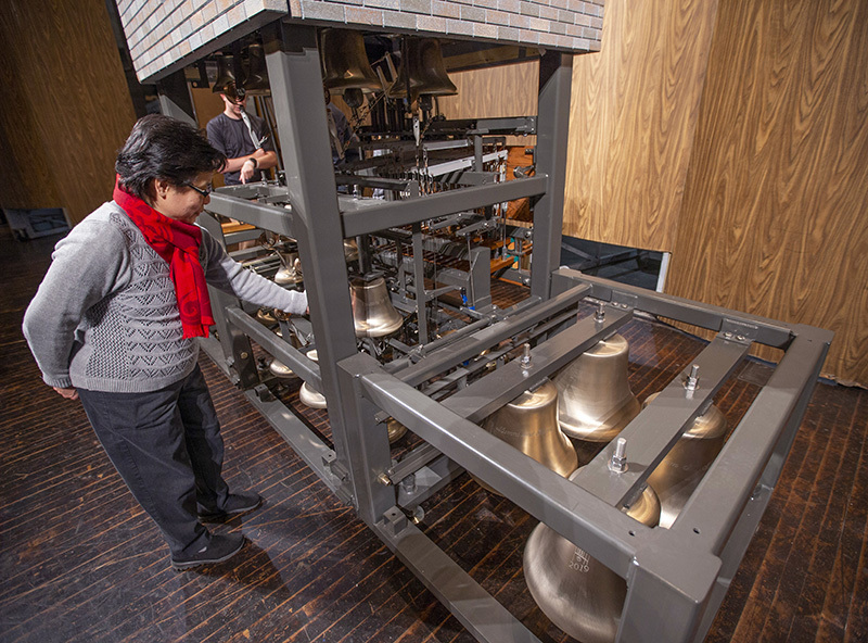 University carillonneur Tin-Shi Tam inspects the assembled model