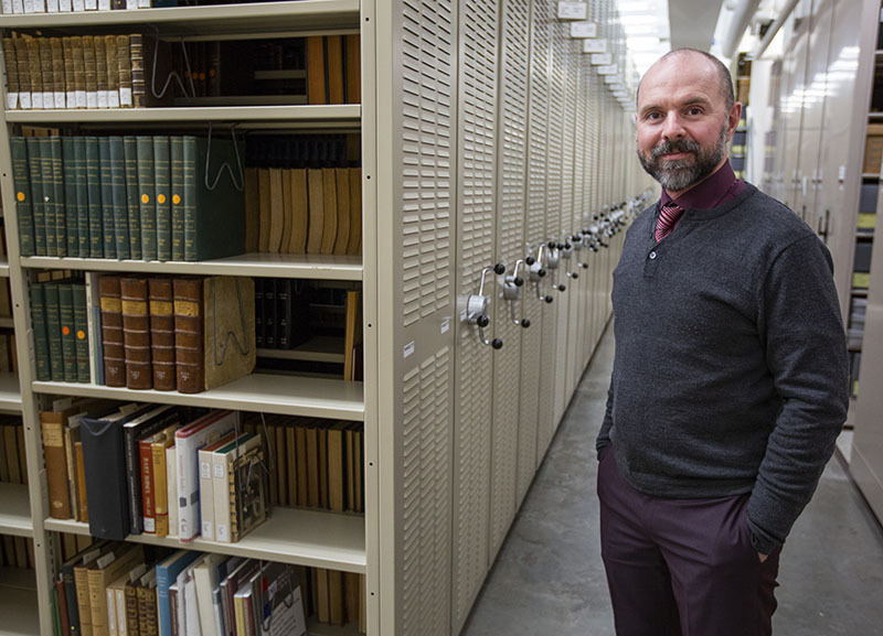 Daniel Hartwig standing in the library archives vault