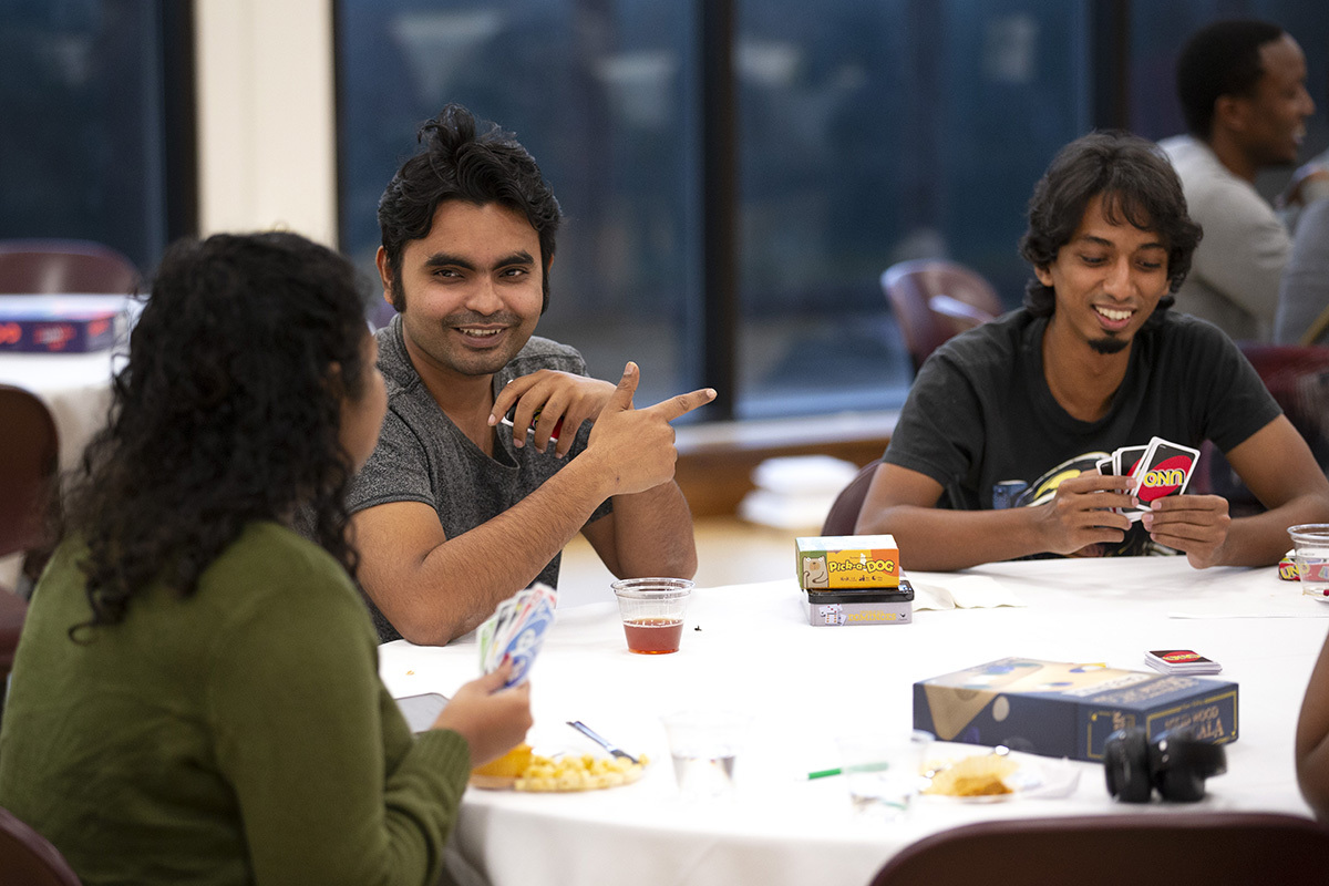 Photo of Sakhawat Saimon and others at community meal.