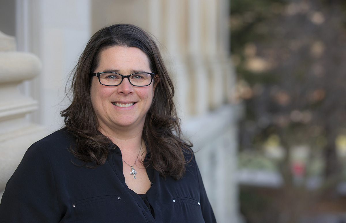 Sue Gudenkauf on the steps of Beardshear Hall