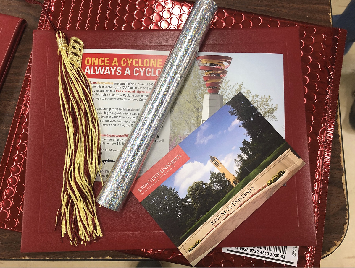 Graduation package with diploma cover, streamer tube and tassel