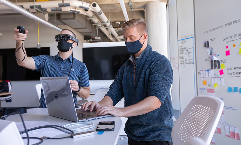 Faculty member and student work on smart glasses project