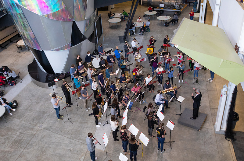 Symphonic band plays in the Howe Hall atrium