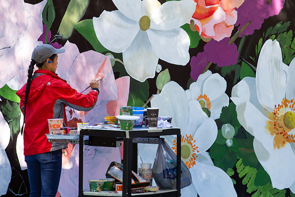 Artist Louise Jones paints floral mural