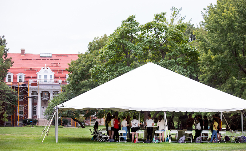 Class meets in large tent on the library quad