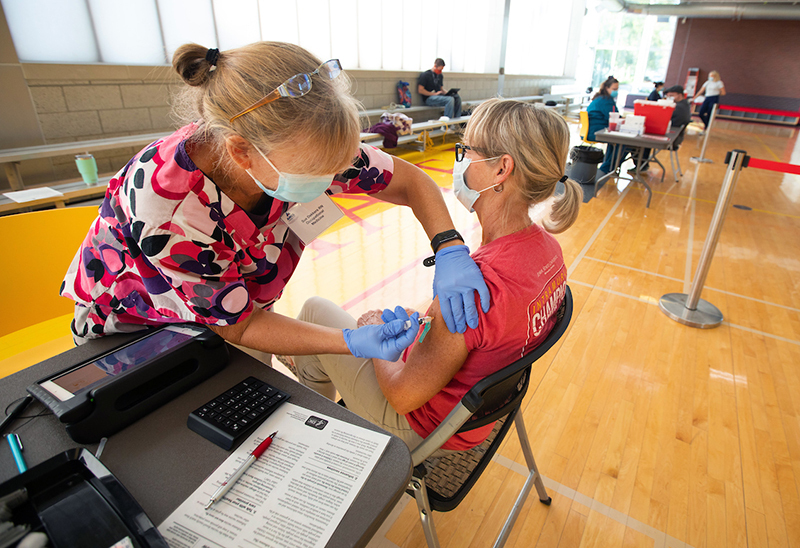 nurse administers a flu shot