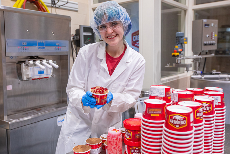 Student Lucy Slizewski hand packs new flavor