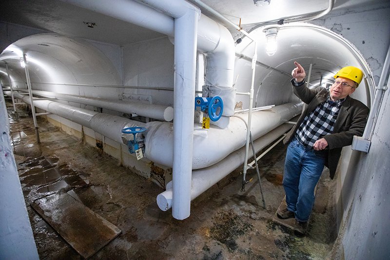 Utilities engineer Mike Murray in at steam tunnel