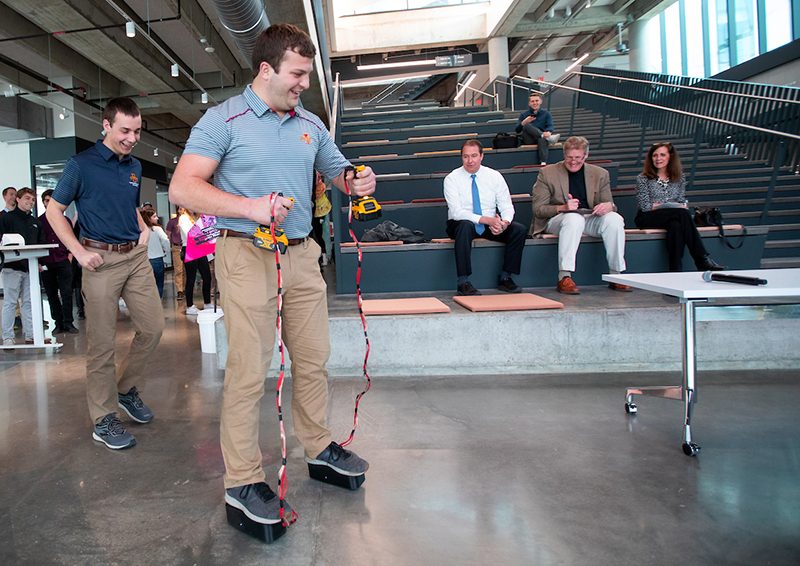 Male student on remote-powered shoe soles