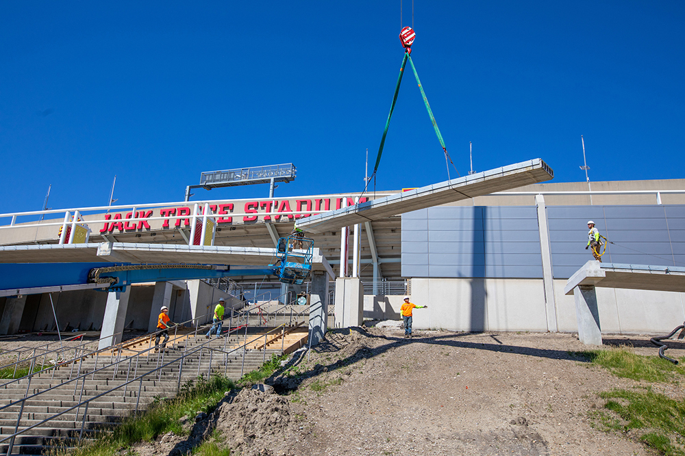 crane lifts walkway section into place