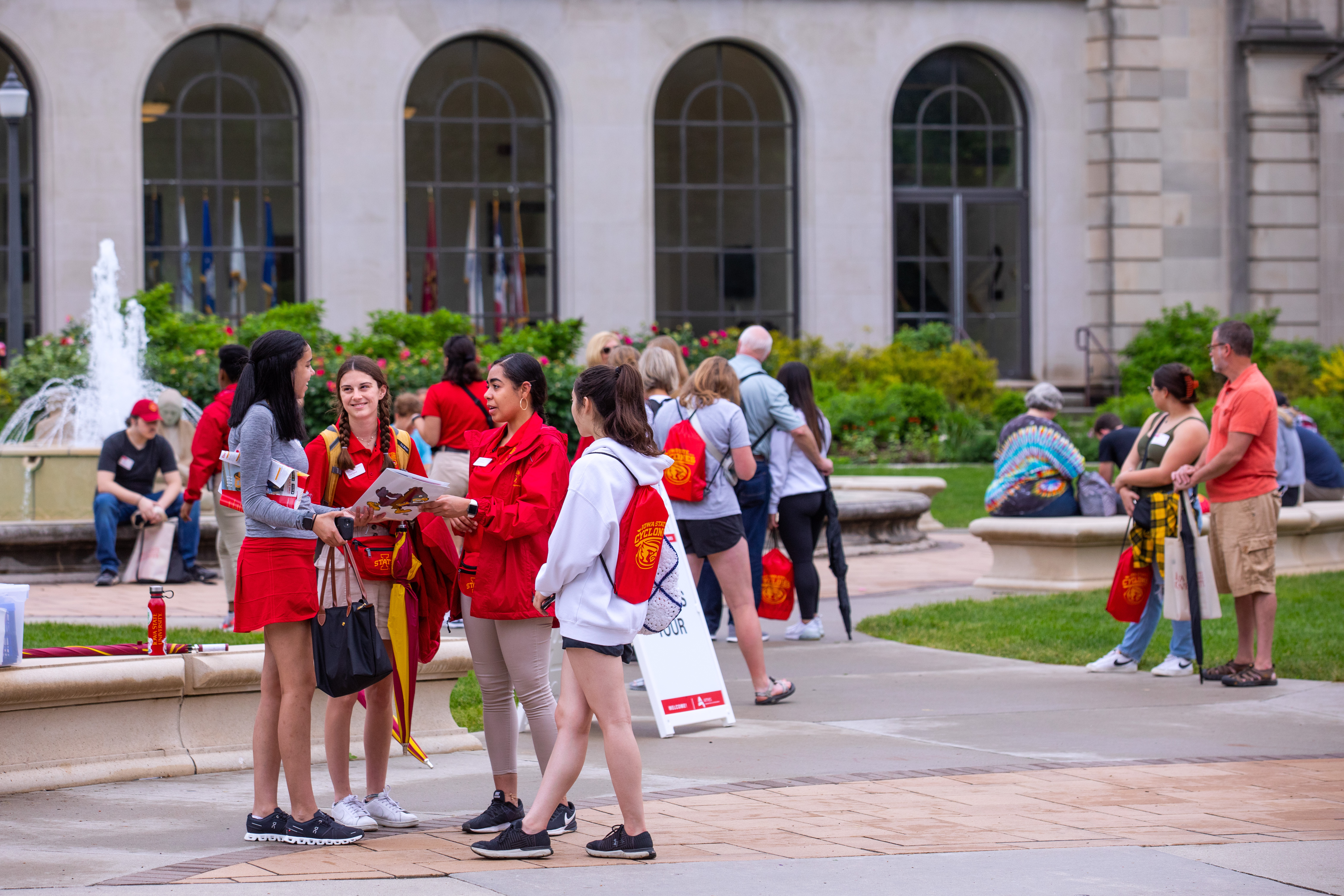 Two Cyclone Aides help students outside the Memorial Union.