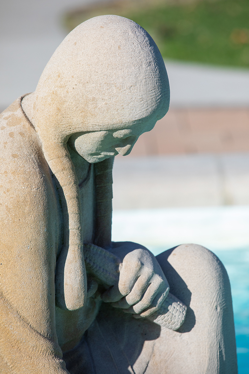 Faded detail in sculpture's hair, clothing